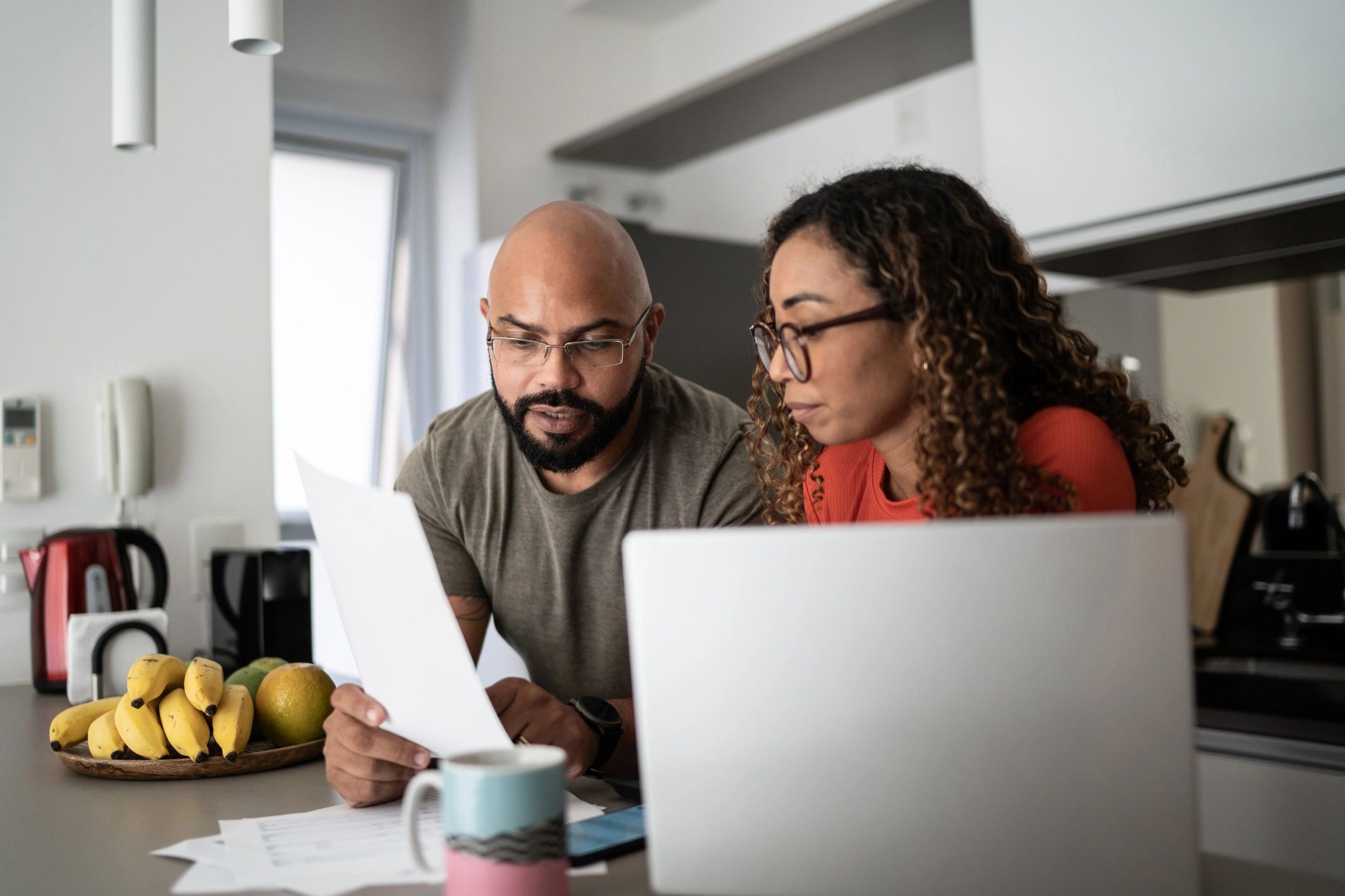Home users reviewing technology issues together